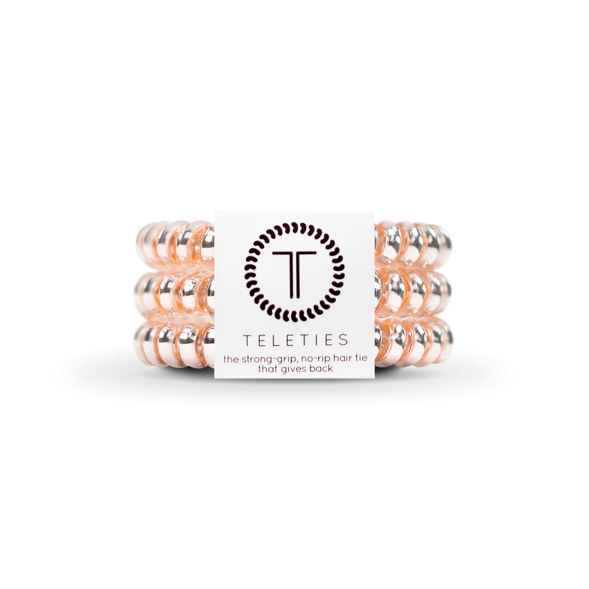 TELETIES Hair Ties: Clear spiral hair ties with a subtle pink tint. Available in sizes: Small and Large.