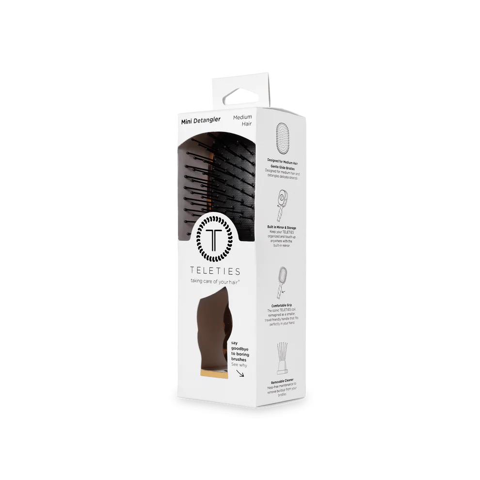 Mini Detangler Brush for Medium Hair in a white box with window; brown tortoise brush visible; available in mini size only.