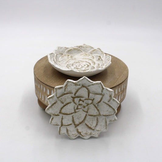 A compact round wooden box with a lift-off lid, topped with an elegant white ceramic flower. Size: 5 inches in diameter.
