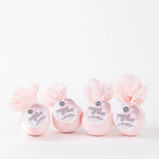 Set of four Sweet Grace Bath Bombs with white tags and pink accents, wrapped in tissue. Available in 4.5 oz size each.
