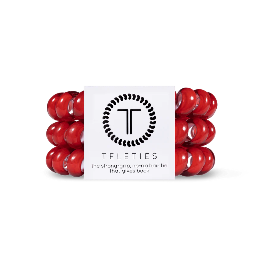 A package of red TELETIES Hair Ties features strong-grip, no-rip accessories. Available sizes: Small, Large.