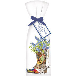 Elegant Lone Star State Towel Sets feature a cowboy boot with blue flowers, a guitar, and a lasso. Includes starfish and "Texas Towel Sets" tag. Available sizes: hand towel and bath towel.
