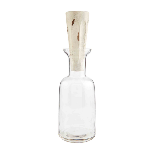 Clear glass decanter with wide base, narrow neck, and mango wood stopper. Available in multiple sizes.