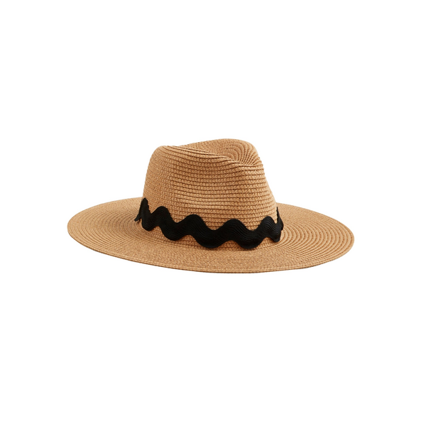 The Ric Rac Fedora is a woven paper straw hat with a wide brim and oversized black ric-rac ribbon trim. Available sizes: S, M, L.