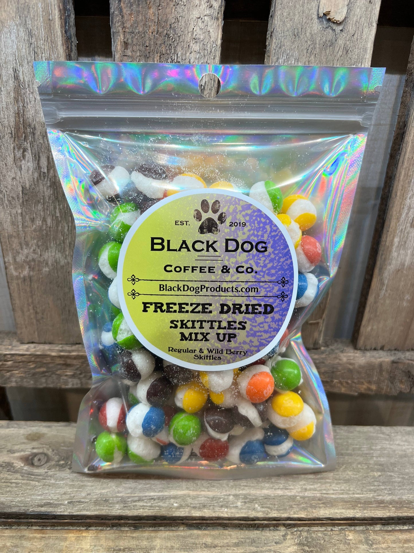 Clear iridescent resealable bag labeled “Freeze Dried Skittles Mix Up” with colorful freeze dried Skittles; available in various sizes.