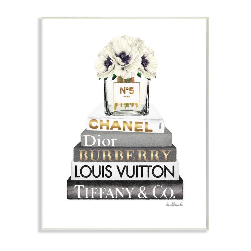 Glam Designer Bookstack wall art: five fashion books, Chanel No. 5 bottle, white flowers. Available in multiple sizes.