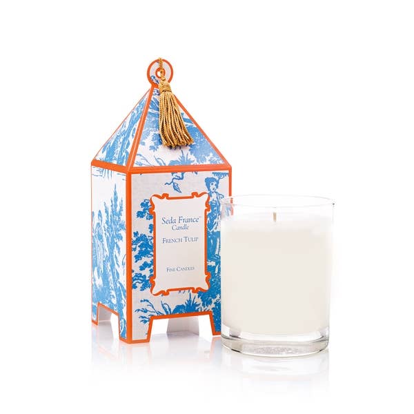 Glass scented candle with label “French Tulip Classic Toile Pagoda Box Candle,” available in small and large sizes.