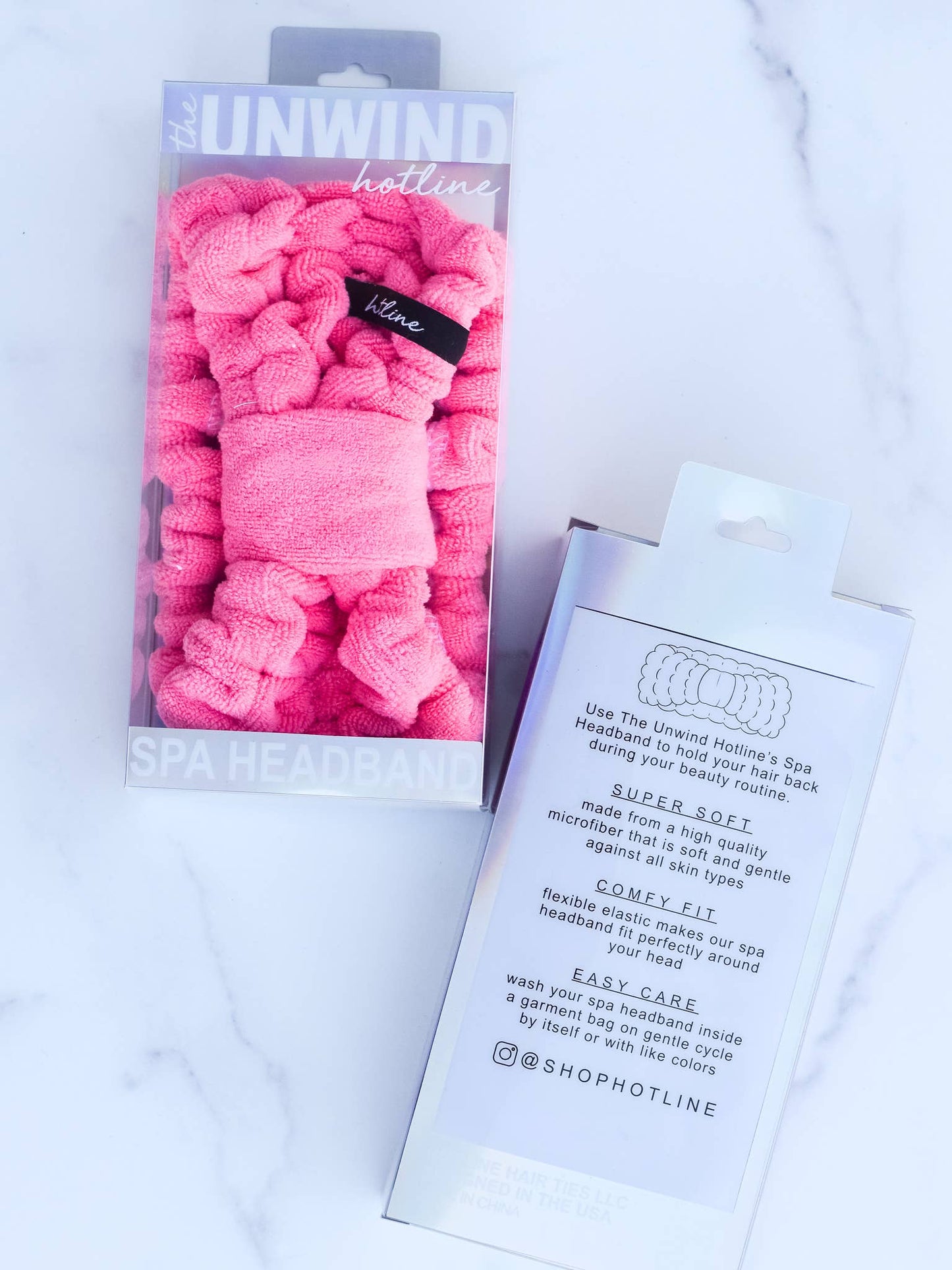 Hot pink Microfiber Spa Headband in packaging; available sizes not shown. Product details and care instructions visible.
