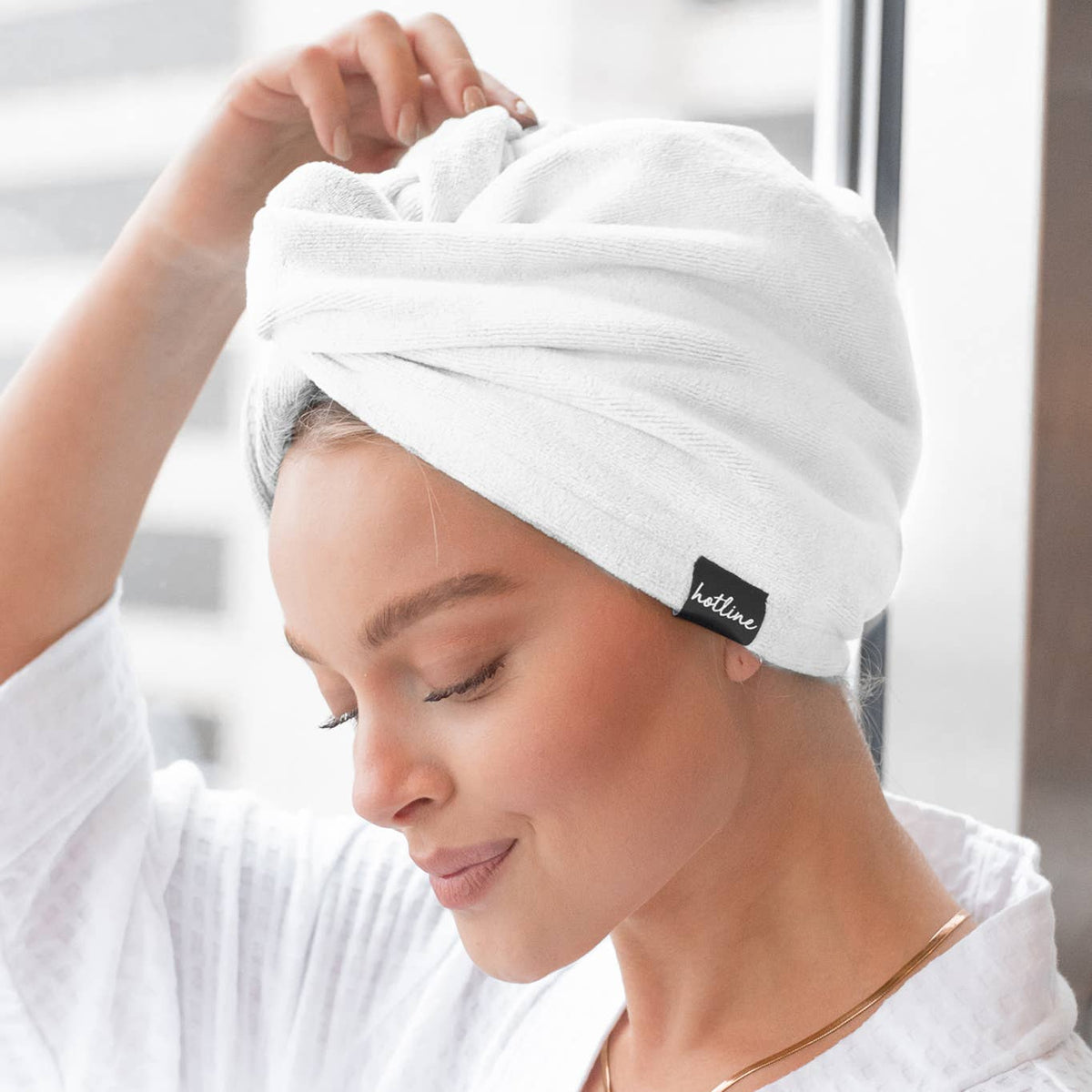 White Microfiber Towel Twist with black "Kitsch" tag; absorbent, available in one size fits most.