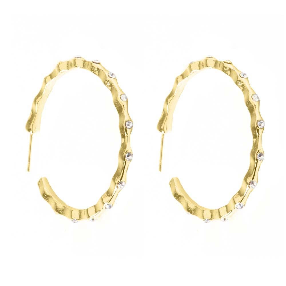 Gold hoop earrings with wavy texture, clear gemstones on edge, post-back closure. Available sizes: small, medium, large.