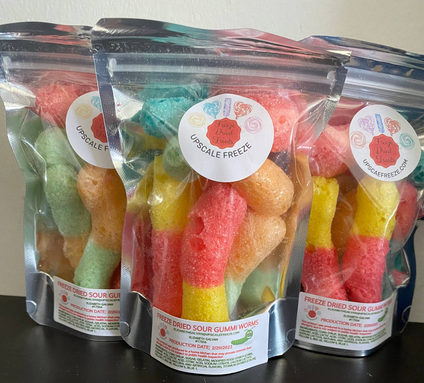 Three clear resealable bags of FREEZE DRIED SOUR WORMS, labeled “Pretty Dope Sweets: Upscale Freeze.” Sizes not shown.