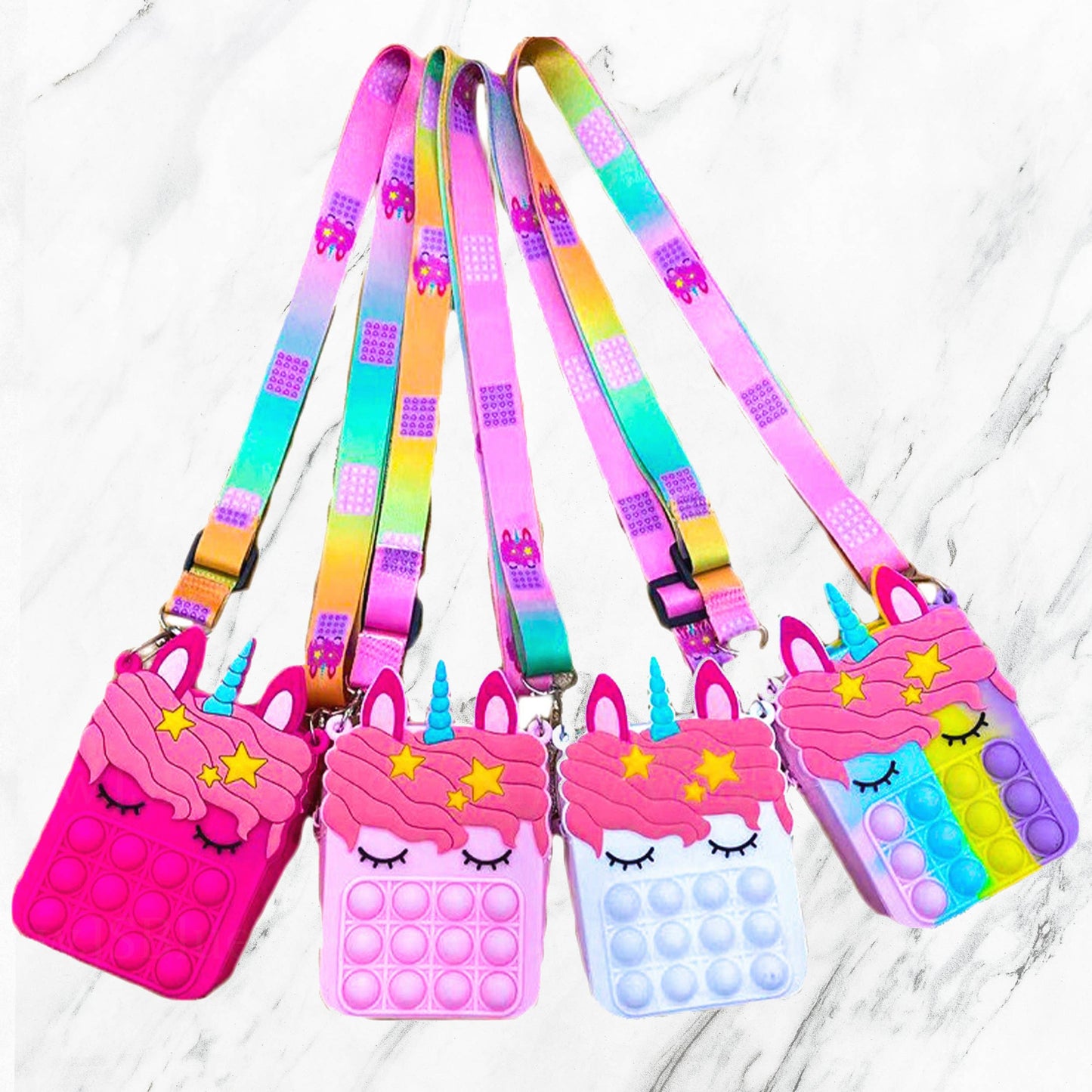 Unicorn-shaped silicone Pop it purses with rainbow straps in pink, purple, or blue. Available sizes: small and medium.