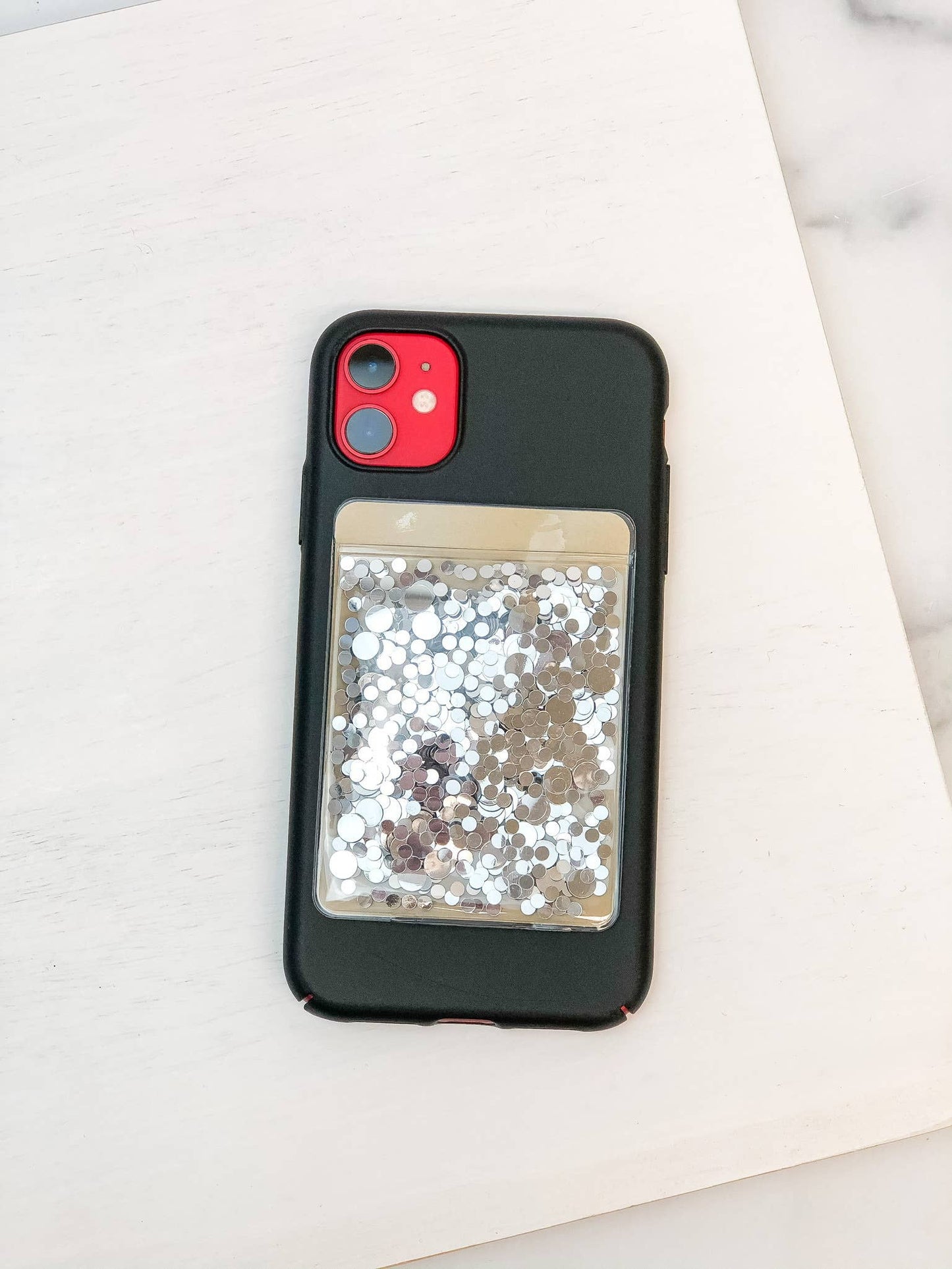 Glitter Phone Card Holder with clear pocket of silver and white sequins; attaches via 3M Peelable Adhesive; sizes: S, M, L.
