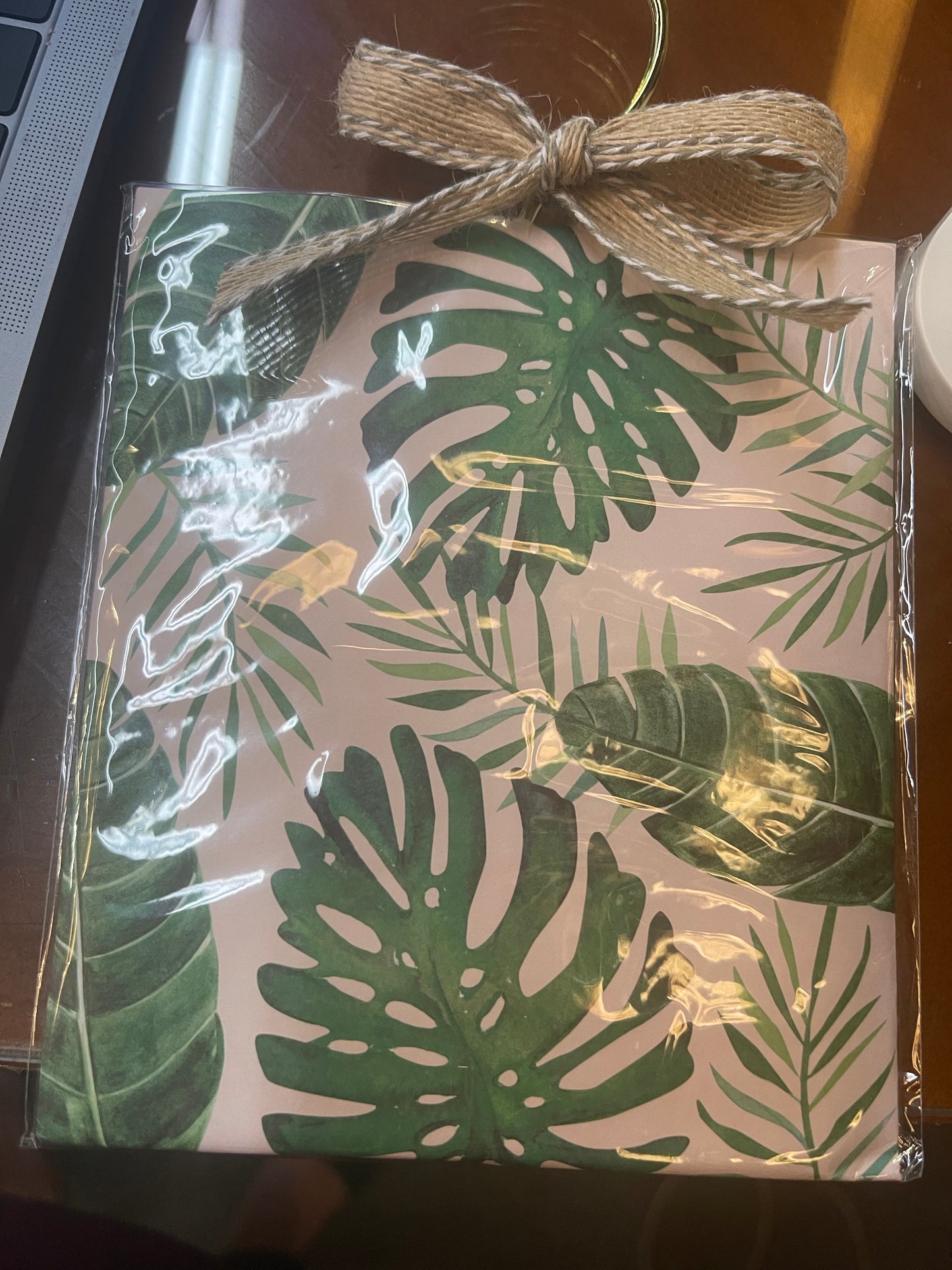 Lady Jayne Ltd. Jasmine Sachet, tropical leaf design, clear plastic wrap, burlap bow. Available in 2oz and 4oz sizes.