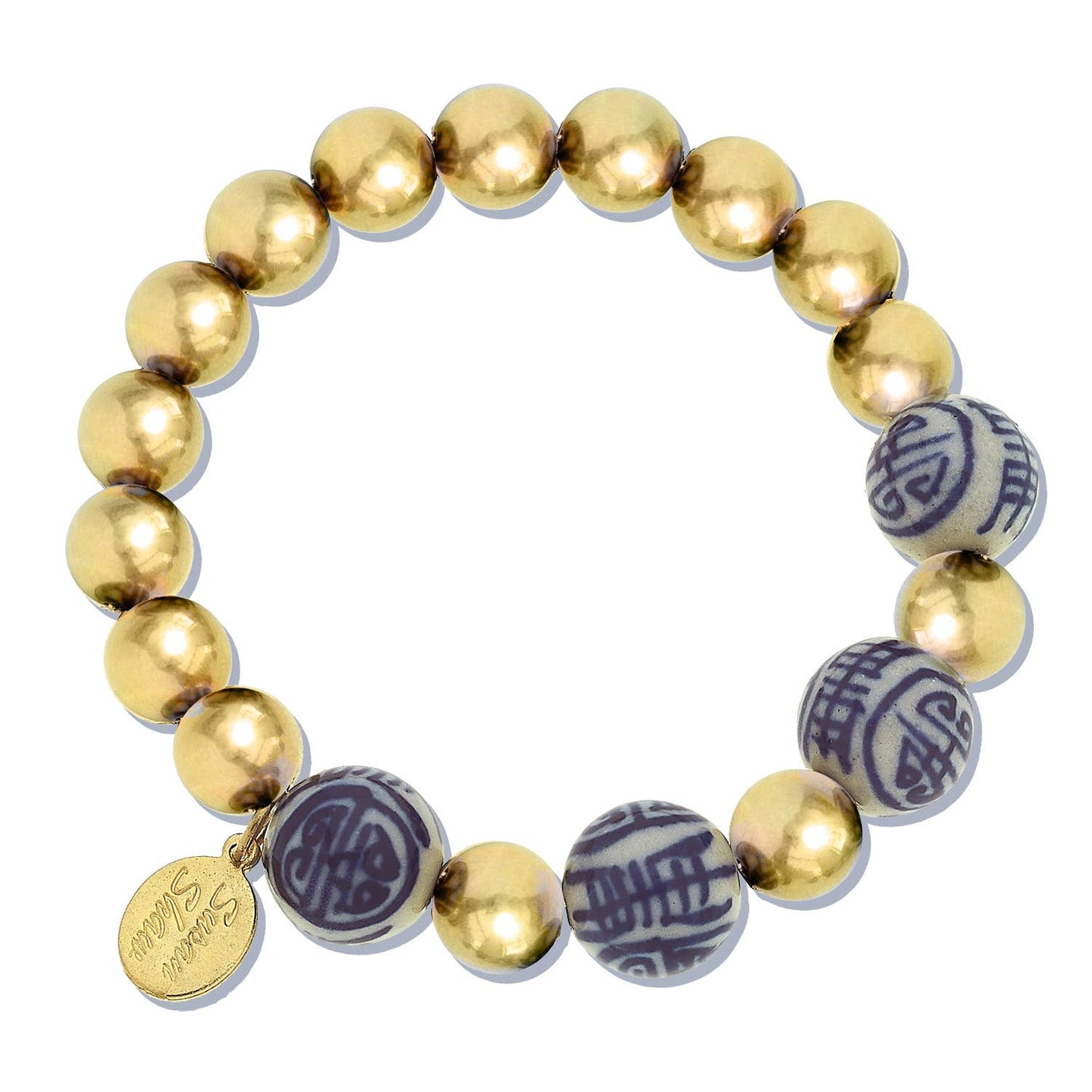 Stretch bracelet with gold-plated beads, blue and white porcelain beads, and a 24Kt gold-plated engraved charm. Sizes: S/M, M/L.