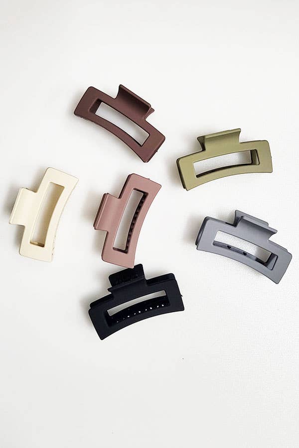 Set of six matte rectangular hair claw clips in cream, beige, pink, brown, olive green, and black. Available in standard size.