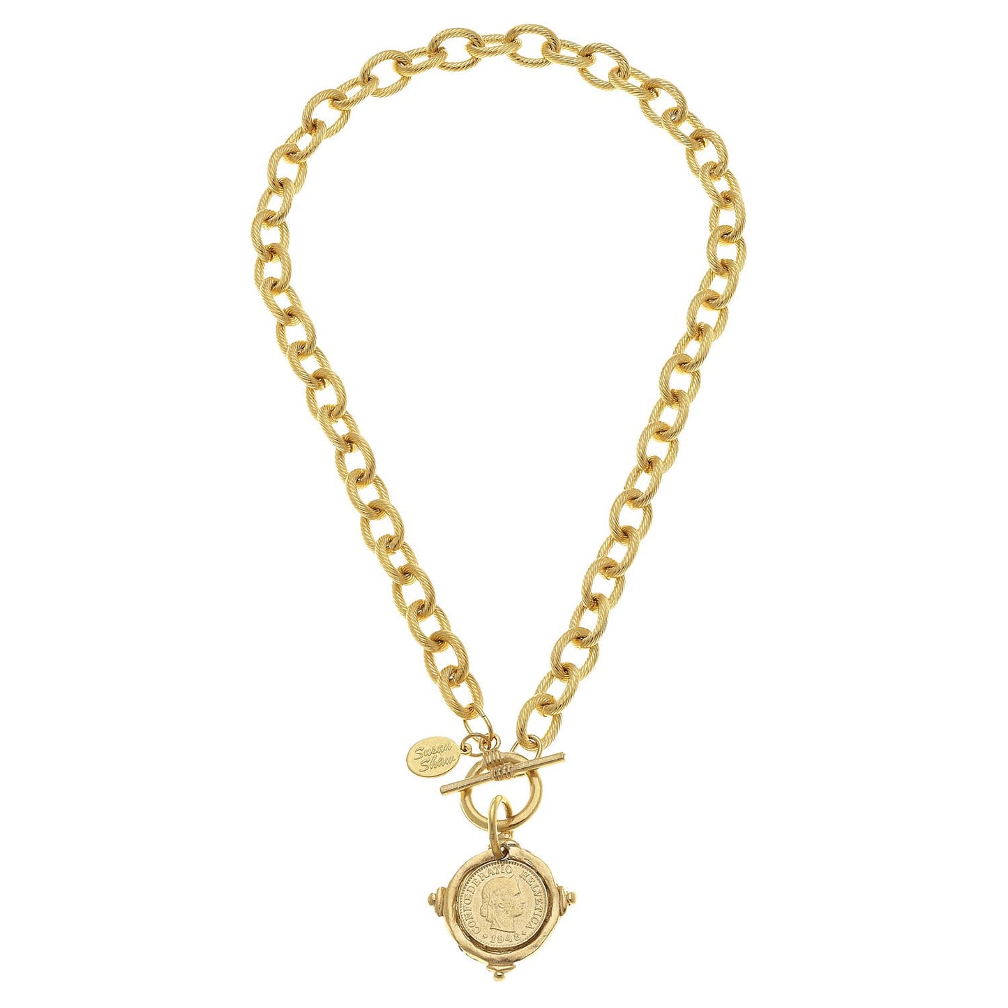Gold necklace with large oval links, ornate coin pendant, front toggle clasp, and small engraved charm. Sizes: S, M, L.