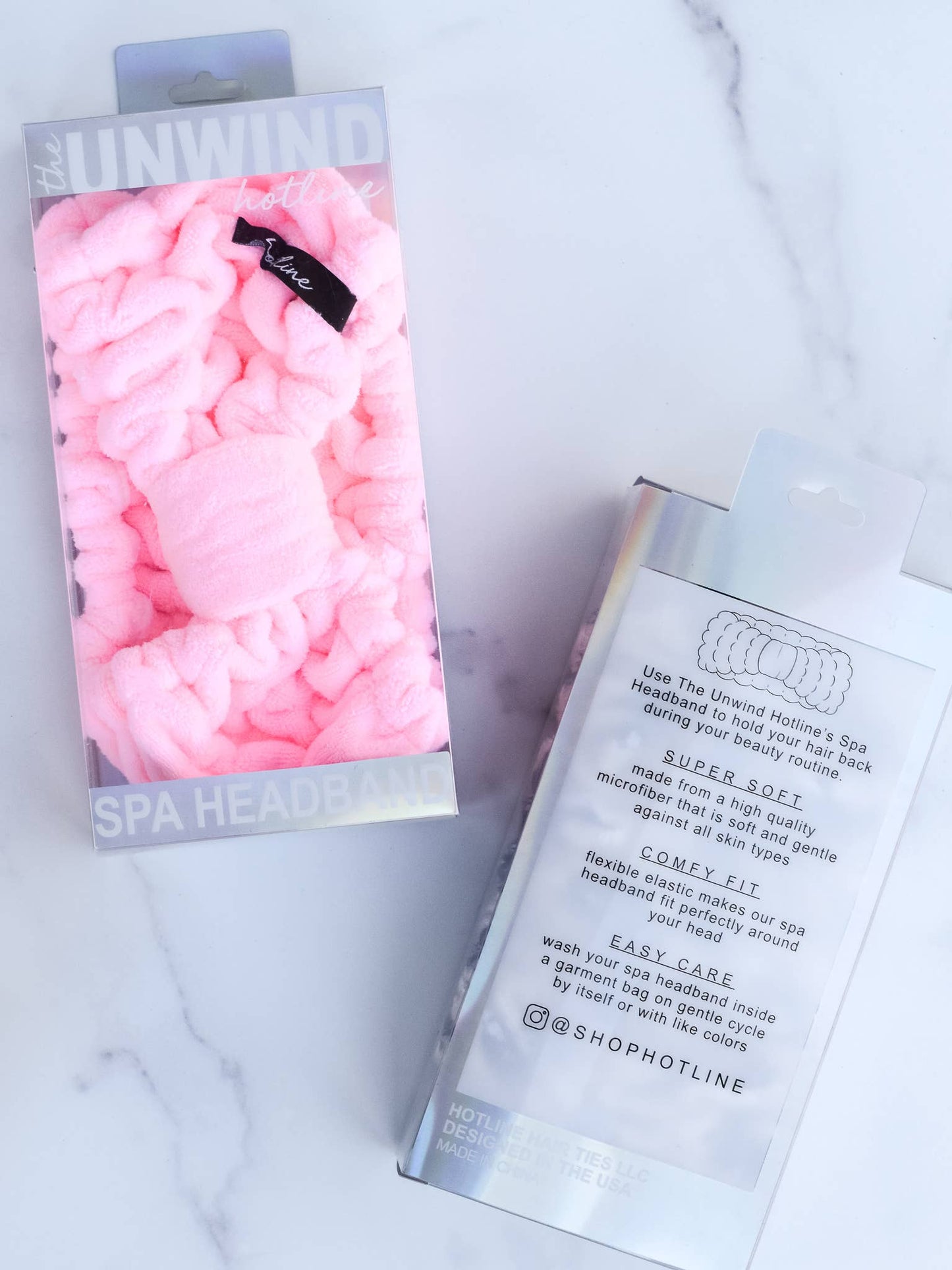 Light pink braided microfiber spa headband in clear packaging, with sizes listed and product details shown on back.