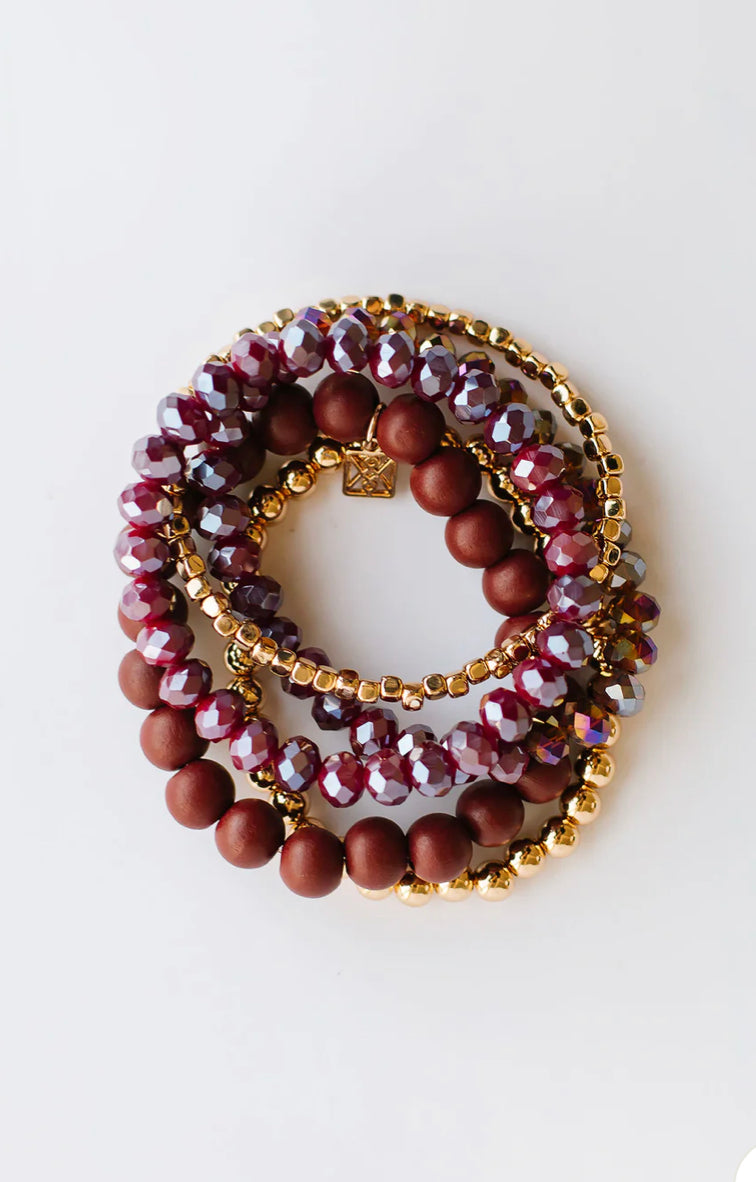 Mandy Bracelet: faceted purple beads, matte burgundy beads, small gold beads. Circular stack. Sizes available: S, M, L.