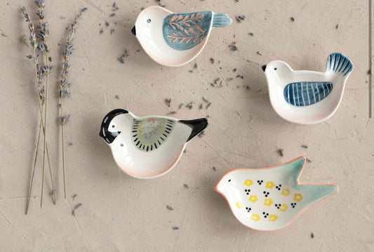 Set of 4 hand-painted stoneware bird-shaped dishes, each with a unique pattern. Four styles. Sizes not specified.