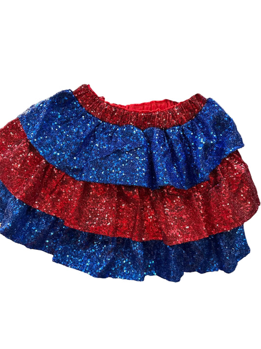 Red and blue sequin mini skirt with sparkly fabric, elastic waistband; available in sizes XS–XL.