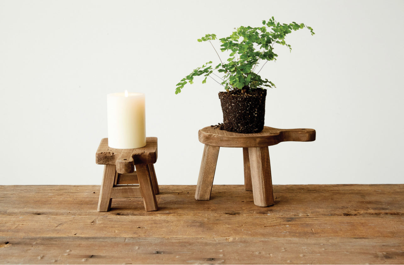 Wood Pedestal With Handle stands, available in small and large sizes, feature a rustic finish and sturdy construction.