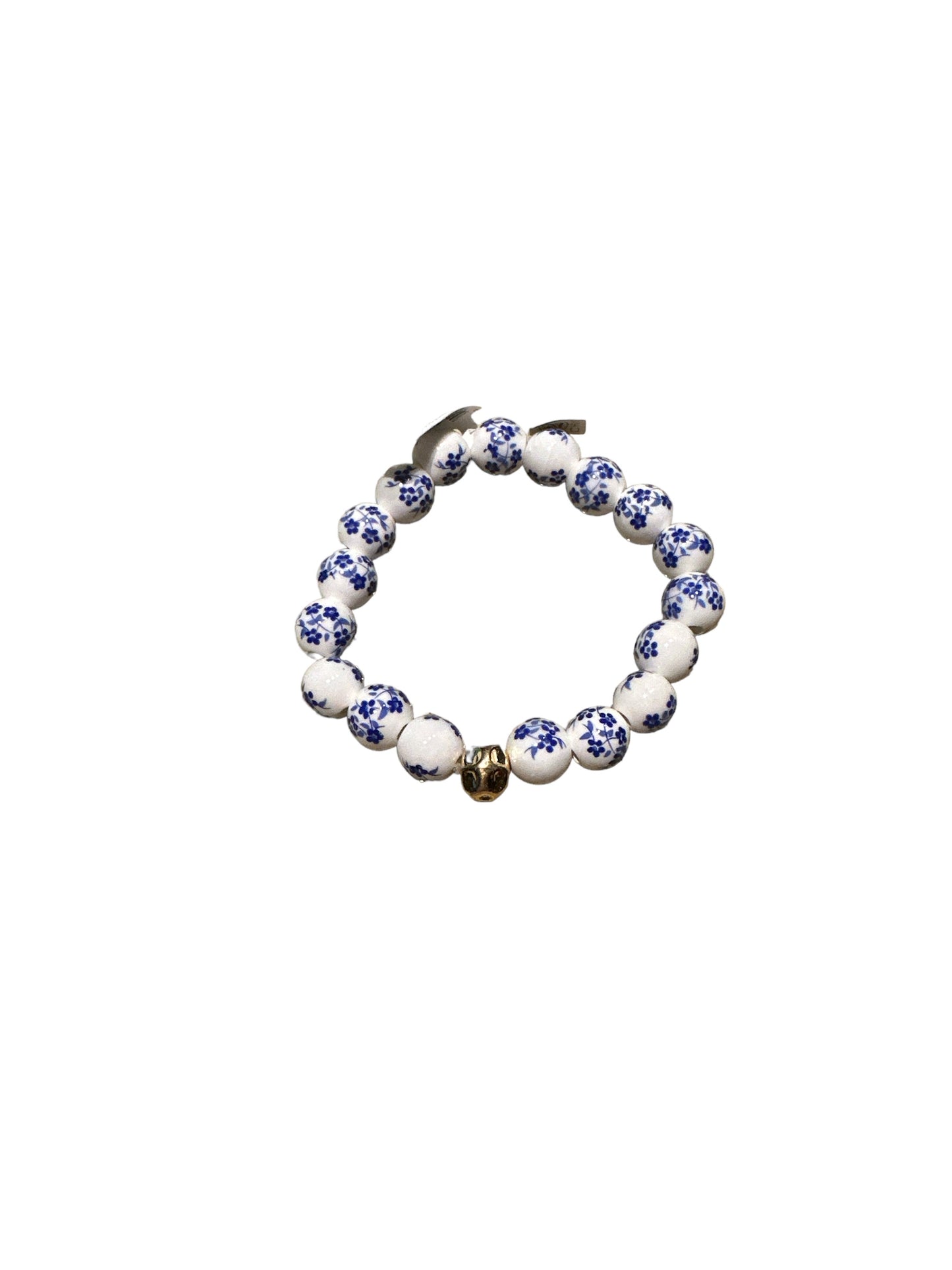 Round white beads with blue floral patterns, gold skull charm. Available sizes: S, M, L.