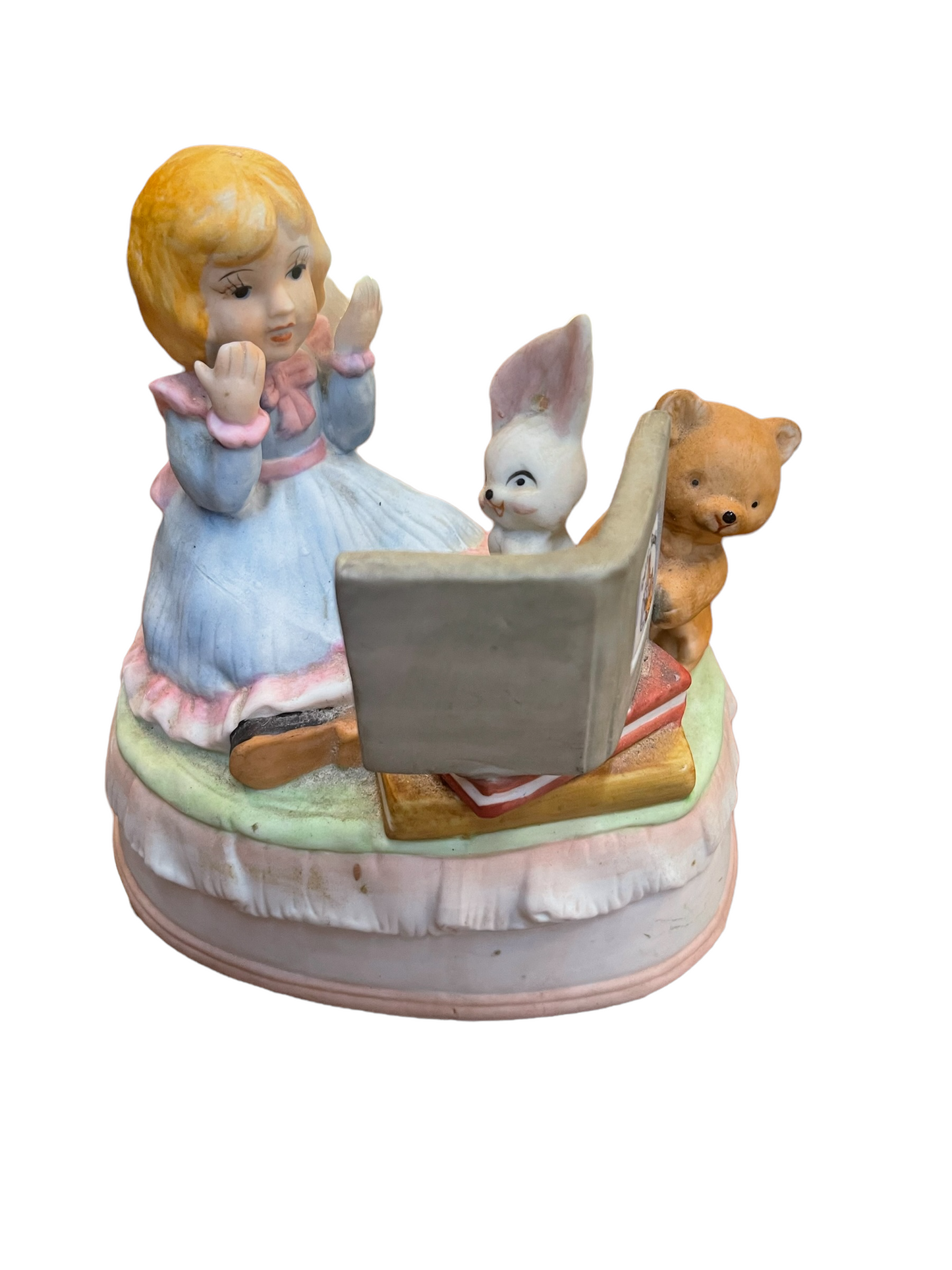 Porcelain music box with girl, rabbit, and bear sitting on a pastel base. Available sizes: small, medium, large.