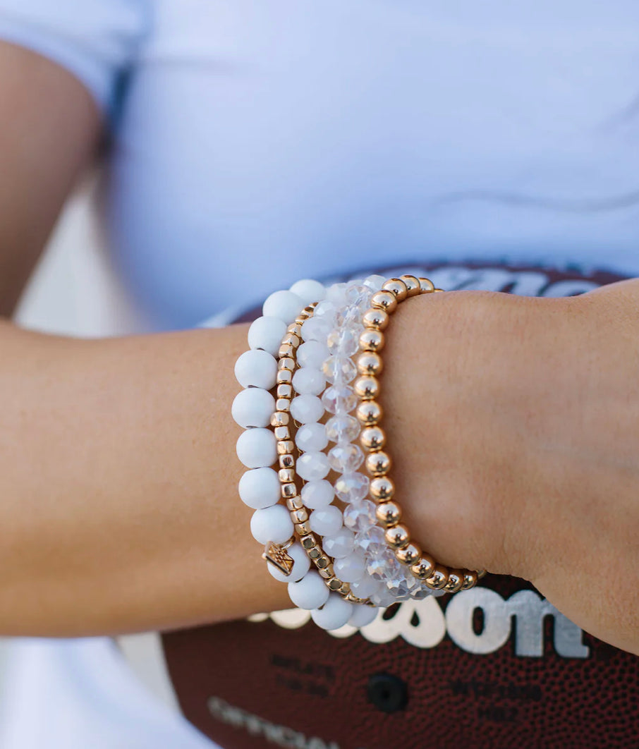 Mandy Bracelet: beaded stack in white, gold, and clear. Available sizes: S, M, L.