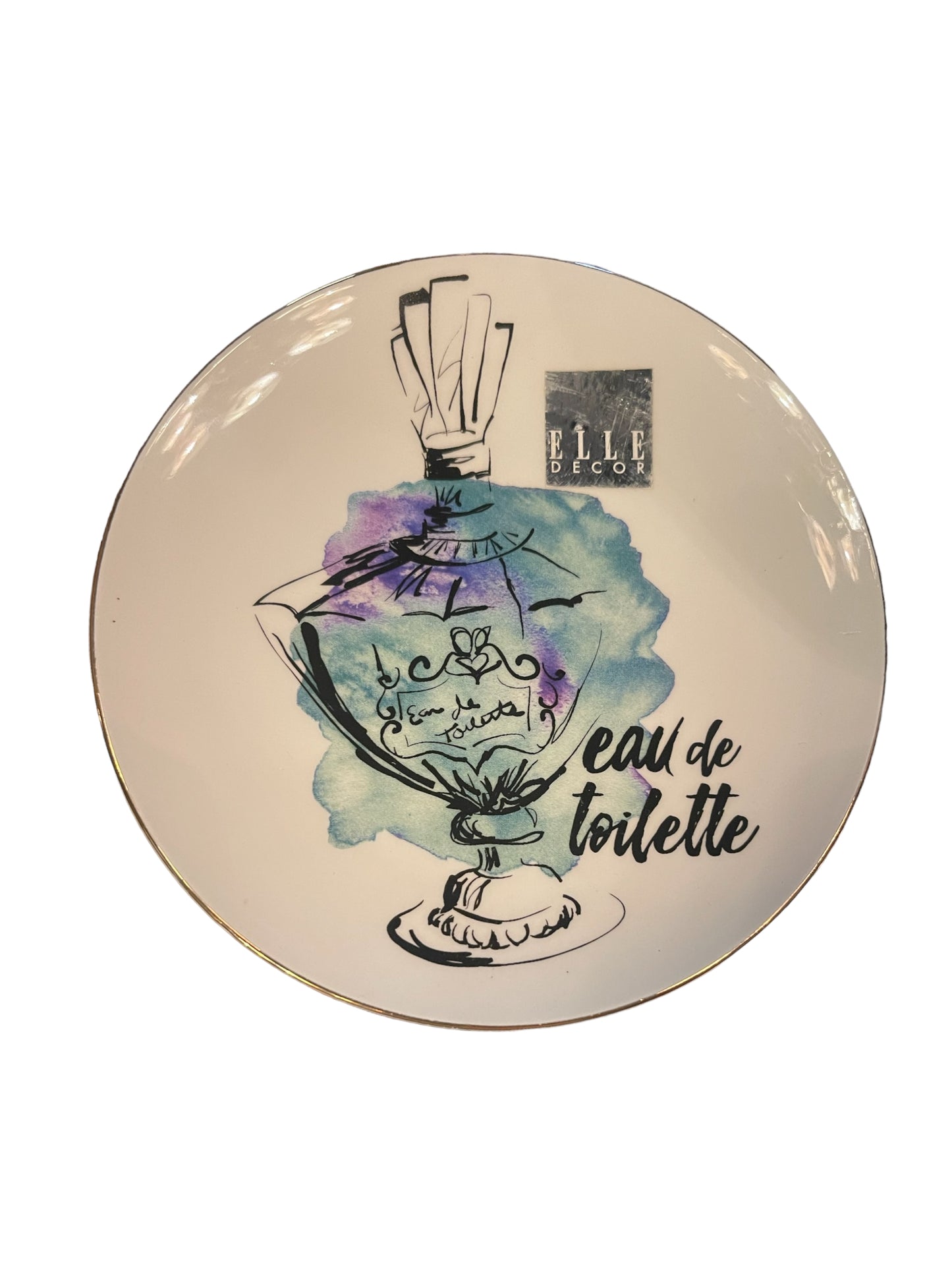 Round Trinket Plate with watercolor perfume bottle, “eau de toilette” in cursive, Elle Decor logo. Sizes: Small, Medium.