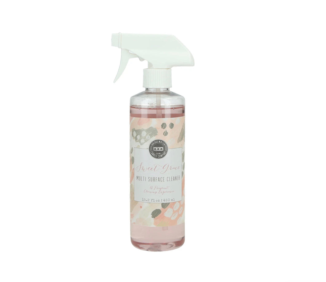 Clear spray bottle with white nozzle, pastel pink/beige/gold label, pink cleaner. Available in 8oz and 16oz sizes.