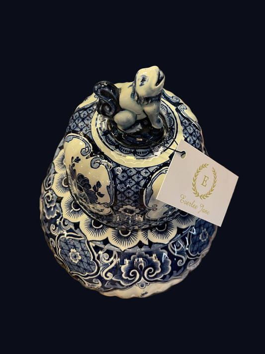 Blue and white porcelain ginger jar, 15.5" tall, with animal finial and "Everlee Jane" tag.