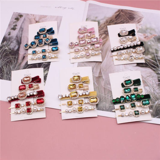 SS15 Pack of 5 velvet hair clips with colorful gemstones and pearls. Available in one size.