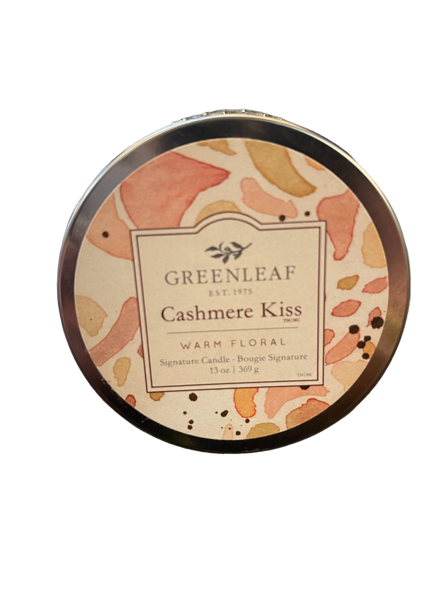 Cashmere Kiss candle in a 13 oz round tin with a watercolor-style label in pink, peach, and gold.