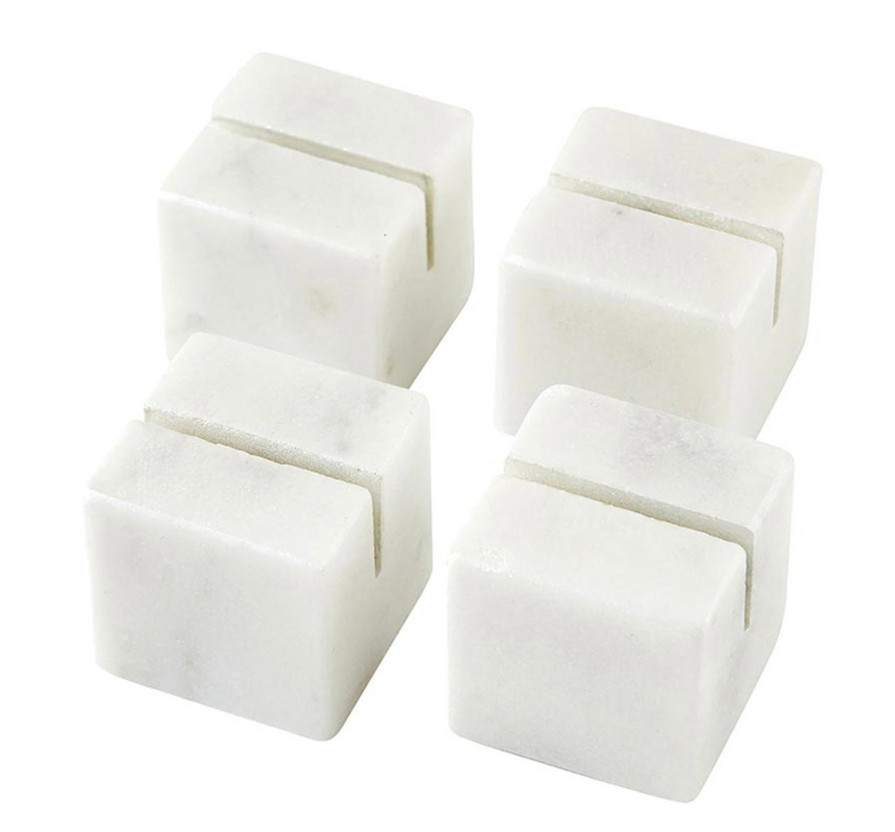 Set of four marble place card holders with a single narrow groove on top. Available sizes: 2", 3", and 4".