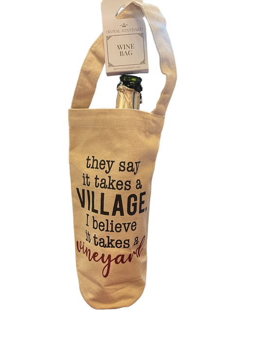 Beige canvas wine bag with handle, quote and tag. Fits one bottled wine. Sizes available: standard bottle size.