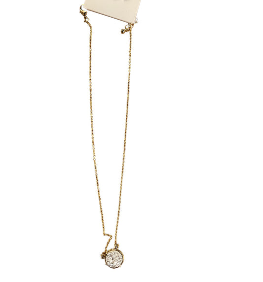 Delicate gold chain with round pendant set with white stones. Available in 16", 18", and 20" lengths.