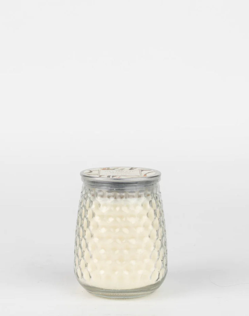 13 oz Magnolia Candle with white wax in a honeycomb glass jar and metal lid.