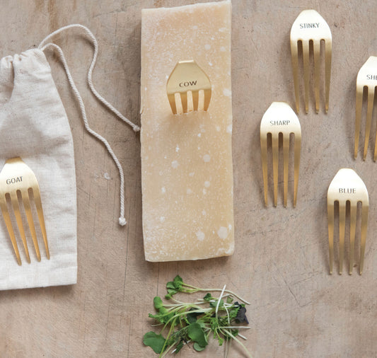 Set of six stainless steel cheese markers labeled COW, STINKY, SHARP, BLUE, and GOAT. Sizes not specified.