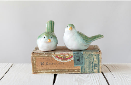 Green and white stoneware bird figurines. Available in small (3") and large (5") sizes. Spring colors.
