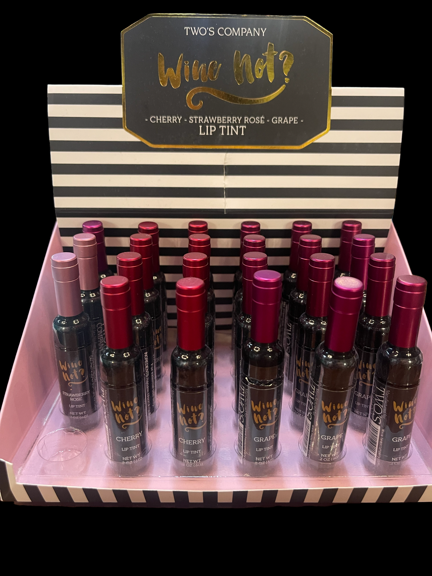 Wine Bottle Lip Tint by Two's Company, cherry and strawberry rose flavors. Pink, black, white striped box; red/purple bottle caps. Sizes not shown.