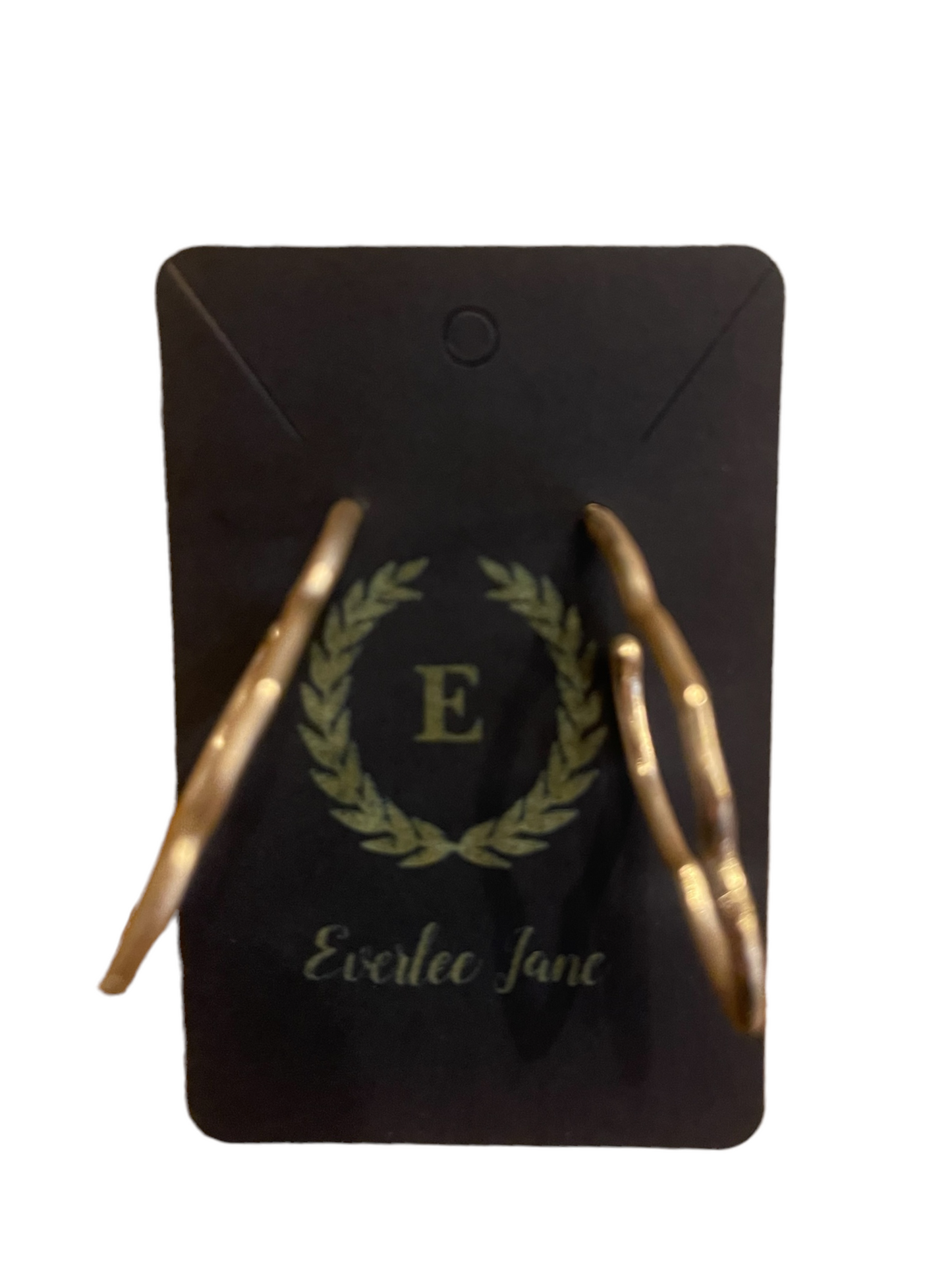 Gold wavy dangle earrings. Sizes available: small, medium, large.