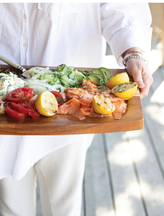 Coarse Black Truffle Salt sprinkled on food. Available in 2 oz and 4 oz jars.