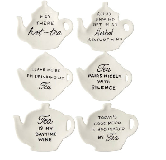 Set of six white teapot-shaped stoneware dishes, each with a unique black tea saying; available in 4-inch size.