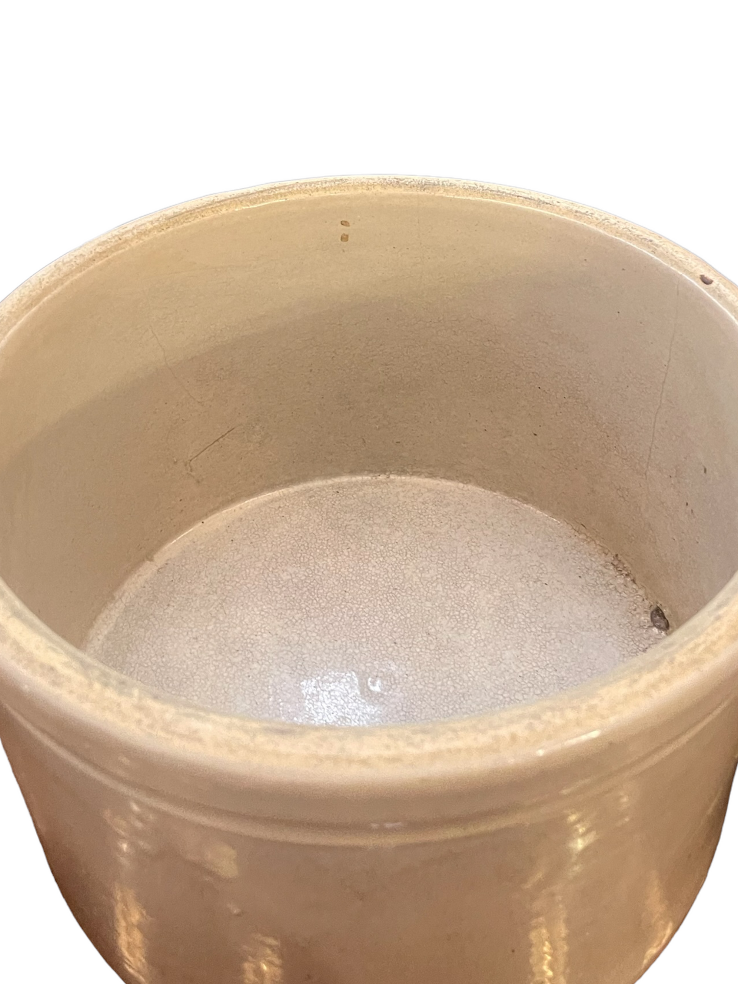 Cream stoneware crock with thick rim, smooth glossy interior, slight imperfections. Available sizes: small, medium, large.
