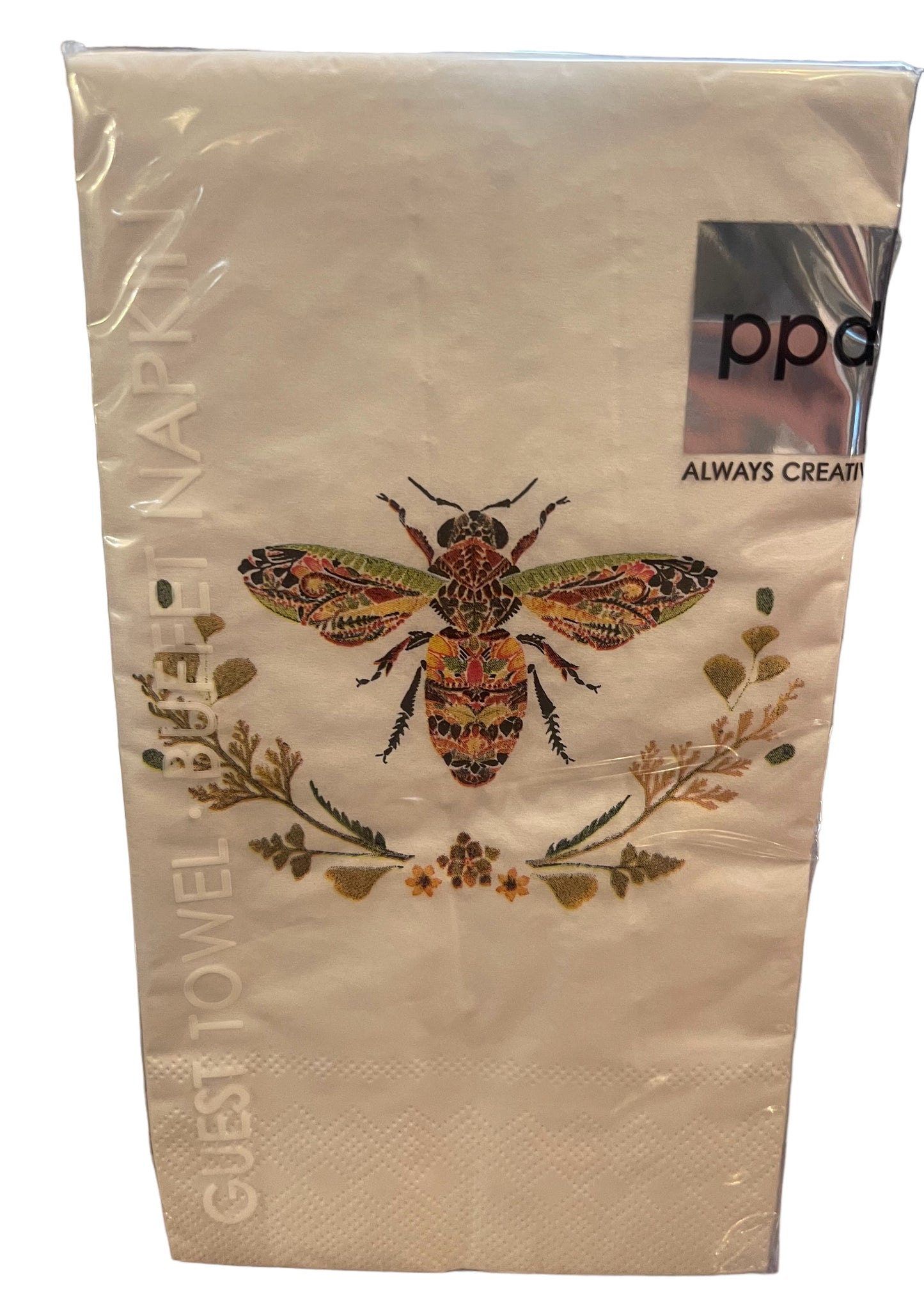 White paper napkin with colorful embroidered bee and flowers, clear plastic-wrapped. Label: "ppd ALWAYS CREATIVE." Sizes: guest.