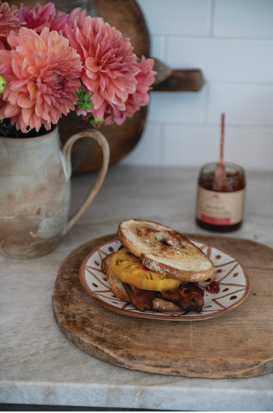Smoked Tomato Truffle Jam jar with spoon. Available in 8oz and 16oz sizes.