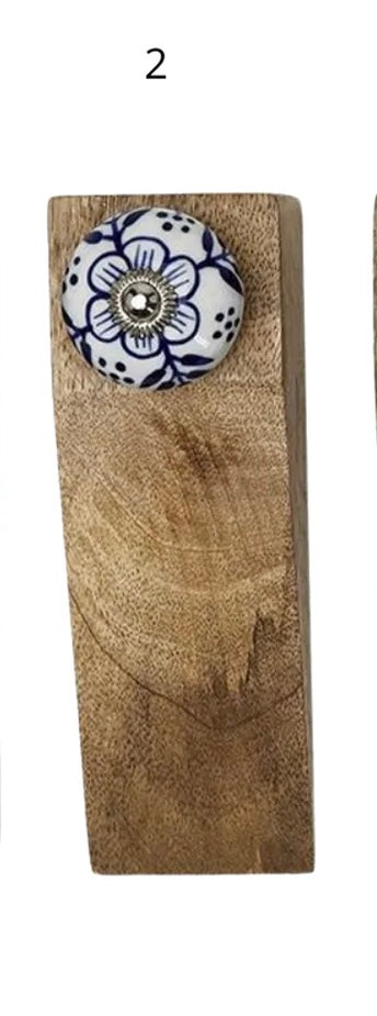 Rectangular mango wood door stop with round blue floral ceramic knob, silver center, and number 2 above. Sizes available.