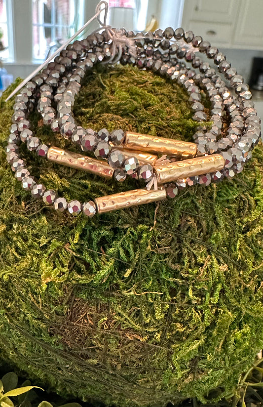 IVA Bracelet with faceted dark iridescent beads and gold accents. Available sizes: S, M, L.