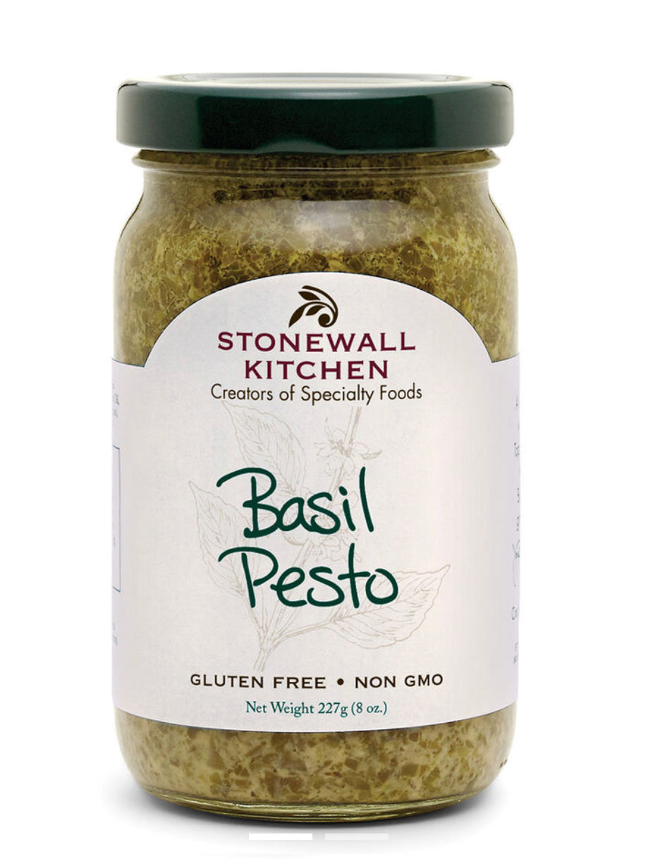 Glass jar of Basil Pesto, green lid, labeled "Basil Pesto," with parmesan cheese. Gluten Free, Non GMO. Net Weight: 227g (8 oz).